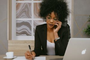 Photo by Anna Shvets: https://www.pexels.com/photo/woman-in-black-blazer-holding-smartphone-3727469/ -- salesperson calling